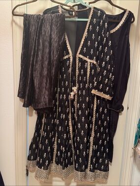 Black organza Embroidered Tie-Front dress. Comes with black crushed pants. 3 pcs